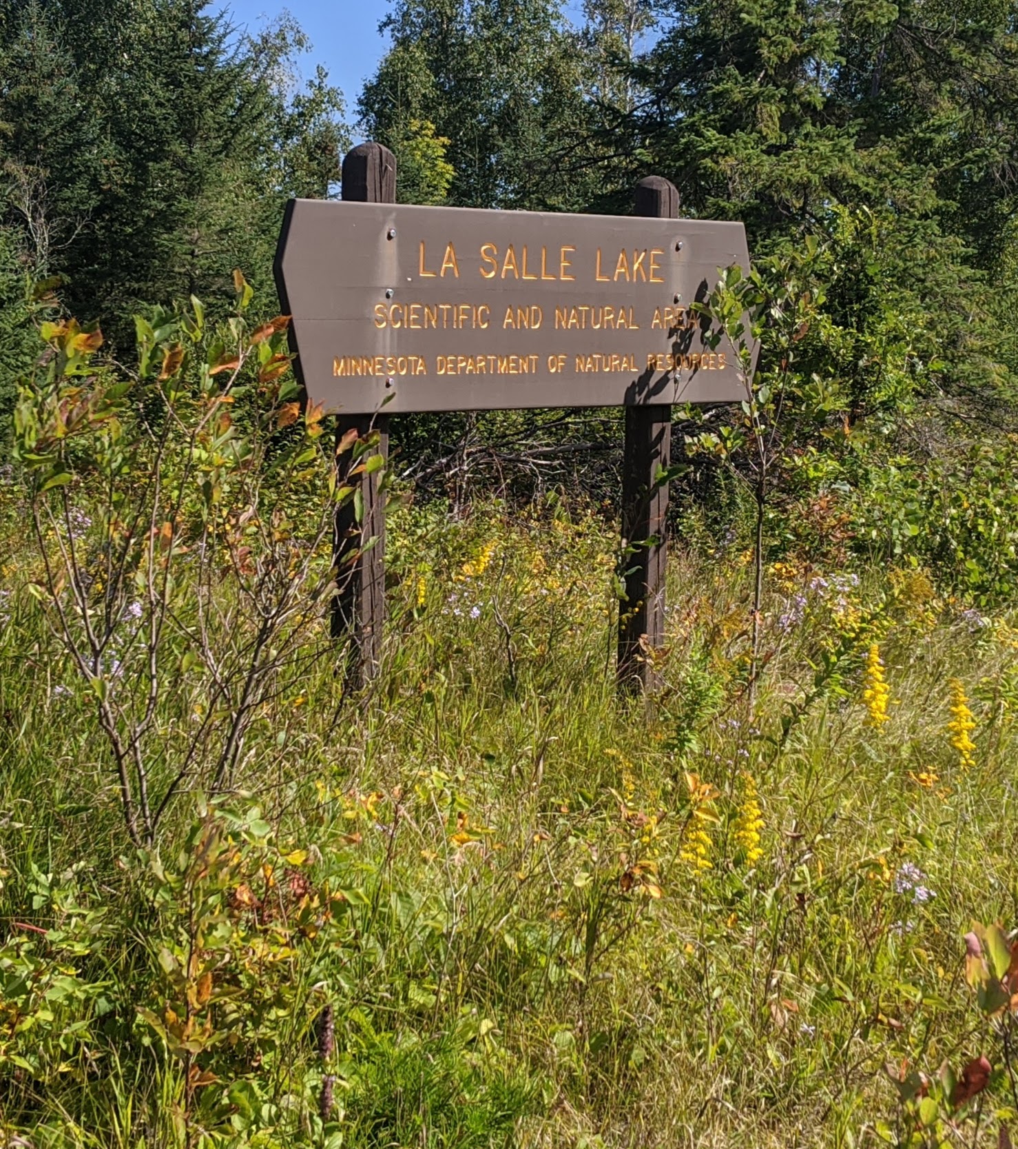 Brown sign at the entrance of La Salle Lake Scientific and Natural Area.